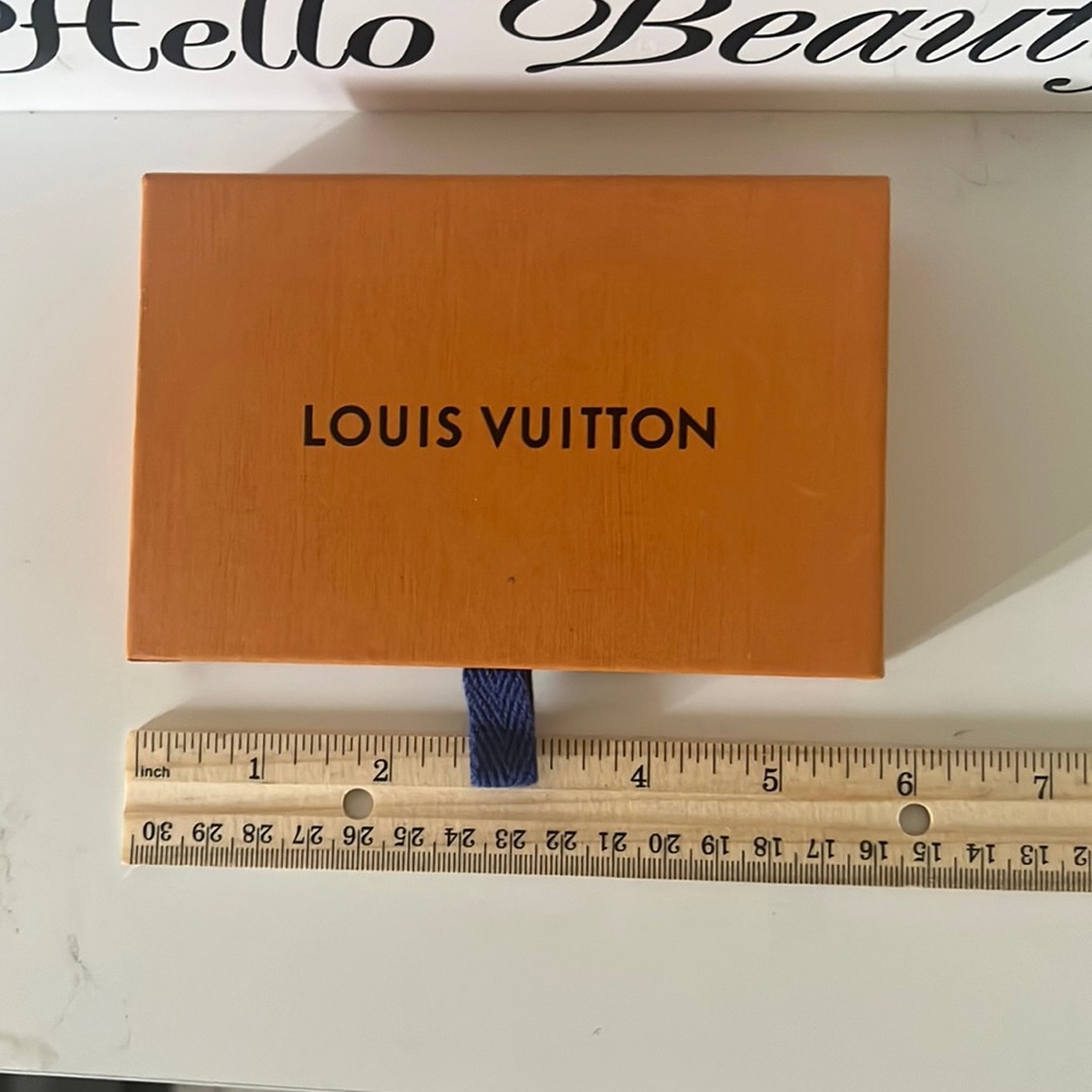 Authentic Louis Vuitton box that came with my purchase .